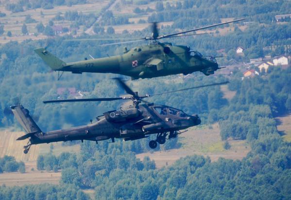 American Apache AH-64D and Polish MI-24 Hind practice  before the parade on the occasion of the Day of the Polish army 